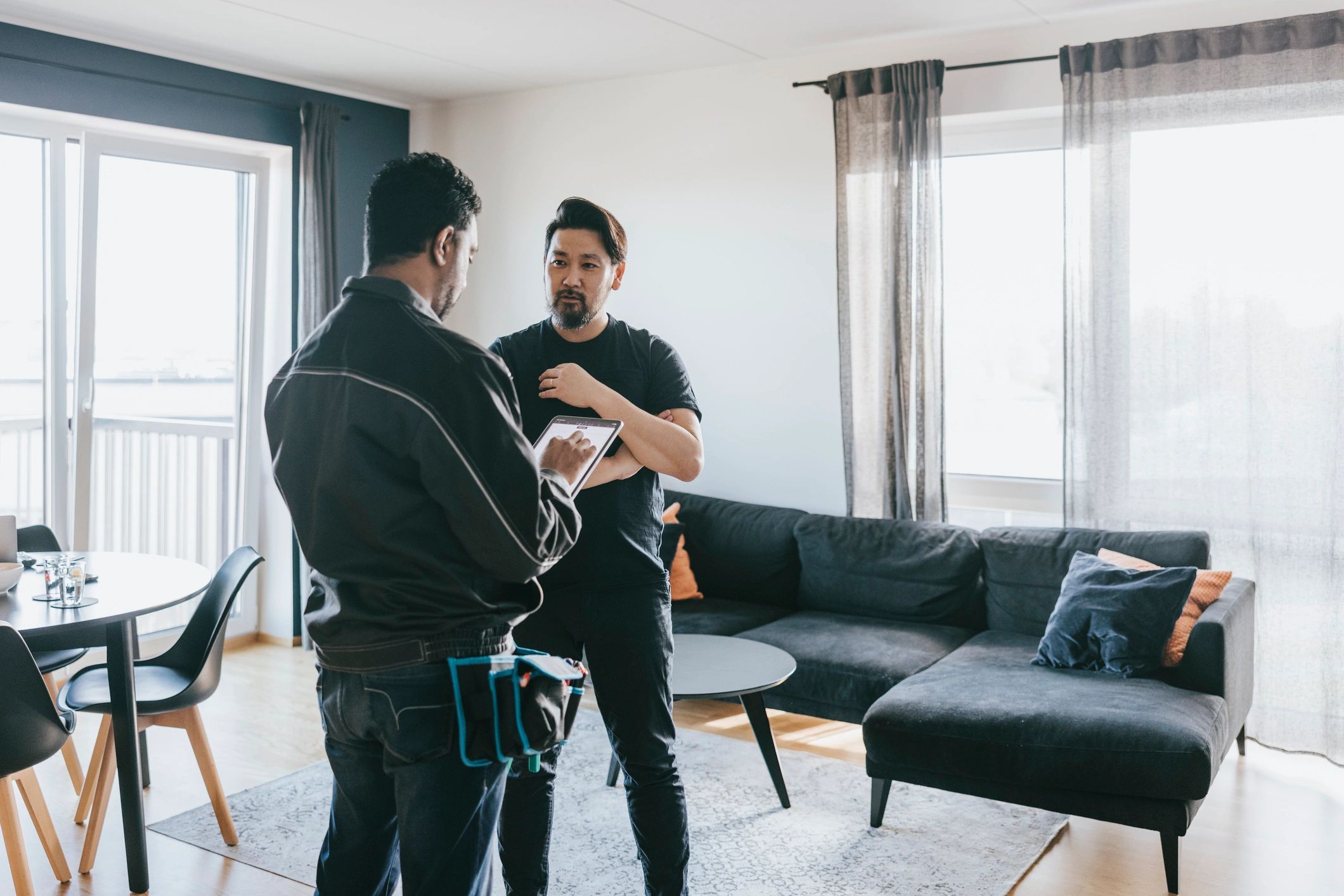 Real estate professional meeting with a client at home
